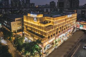 an overhead view of a building in a city at night at Atour Hotel Guangzhou Zhujiang New Town Wuyangtun in Guangzhou