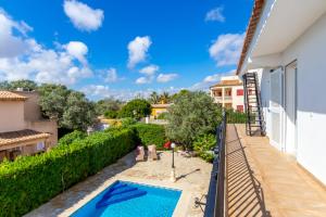a view from the balcony of a house with a swimming pool at Can Joan in Santanyi
