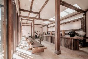 a large room with wooden beams and tables at Sahe Hotel Shanghai World Expo in Shanghai
