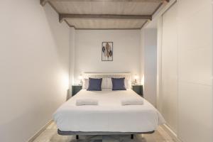En eller flere senge i et værelse på Apartamentos Realejo Granada Centro 3000