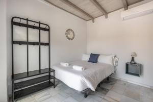 Posteľ alebo postele v izbe v ubytovaní Apartamentos Realejo Granada Centro 3000
