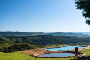 a view of a river in a valley at Dargle Forest Lodge in Dargle