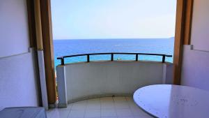 a room with a view of the ocean from a balcony at Appartement 753, 4 personnes, vue mer By Palmazur in Cannes