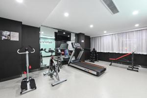a gym with several exercise bikes and a treadmill at Atour S Hotel Beijing Sanlitun Guoan in Beijing