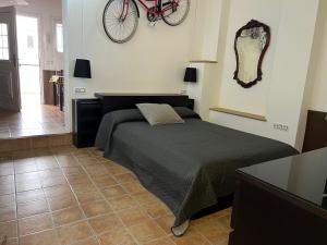 Postel nebo postele na pokoji v ubytování LOFT Del SOL, Centro del Pueblo con Aire Acondicionado