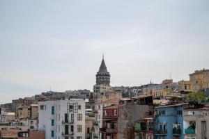 a view of a city with a clock tower at Nomado Residence with gym in Istanbul