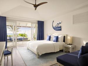 a bedroom with a bed and a view of the ocean at Villa Nautica Paradise Island Resort in Himmafushi +119 photos