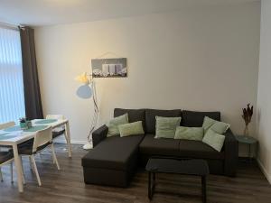 a living room with a couch and a table at Poelgeeststraat in Leiden