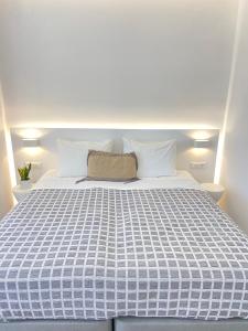 Cama ou camas em um quarto em Sea Wind Villas and Suites