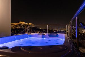 The swimming pool at or close to Majestic Acropolis-Lycabettus