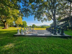 a giant chessboard in a park in the grass at The Venue Country Hotel & Spa in Hartbeespoort