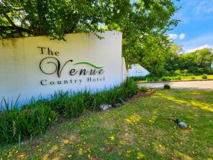a sign for the venne county hotel at The Venue Country Hotel & Spa in Hartbeespoort