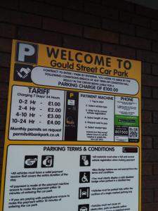 a sign that says welcome to a gold street car park at At home Property in Manchester