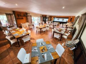 an overhead view of a restaurant with tables and chairs at The Venue Country Hotel & Spa in Hartbeespoort