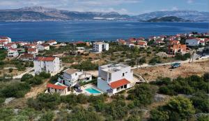 an aerial view of a town with the water at Villa Bora - Ferienhaus am Meer in Slatine