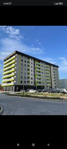 a large apartment building on the side of a street at Apartman Stan ,Istocno Sarajevo 26 in Donje Mladice