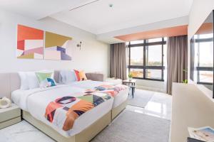 a bedroom with a large bed and a large window at Brassbell apartments in Giza in Cairo