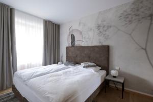 En eller flere senger på et rom på Mair Appartements in Schenna