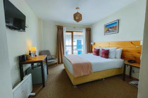 Cama ou camas em um quarto em Cooper Hotel Boutique