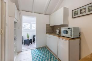 Kuchyň nebo kuchyňský kout v ubytování Apartment Stella