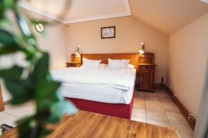 Voodi või voodid majutusasutuse Šumava Inn toas