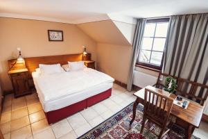 Voodi või voodid majutusasutuse Šumava Inn toas