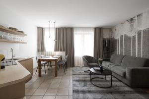 a living room with a couch and a table at Mair Appartements in Schenna in Schenna