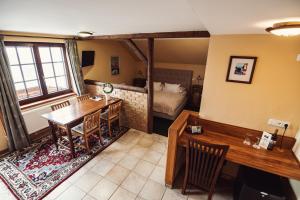 Voodi või voodid majutusasutuse Šumava Inn toas