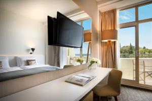 Ein Bett oder Betten in einem Zimmer der Unterkunft Remisens Hotel Albatros-All inclusive
