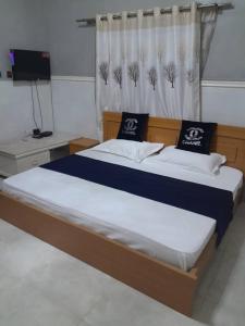 מיטה או מיטות בחדר ב-Paulight Residence