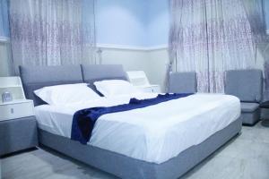 מיטה או מיטות בחדר ב-Paulight Residence