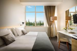 Ein Bett oder Betten in einem Zimmer der Unterkunft Remisens Hotel Albatros-All inclusive