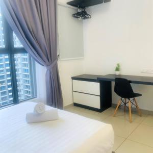 a bedroom with a desk and a bed and a chair at Atlantis Residence#3409#1Bedroom#2-4Pax# in Melaka