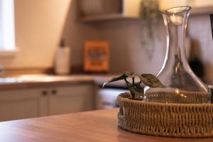 a glass vase and two small plants on a table at The Willows in Newton-le-Willows