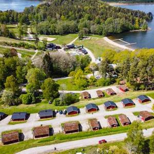 an aerial view of a campgrounds next to a lake at Stockholm Swecamp Flottsbro in Huddinge