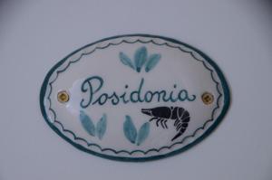 a plate with the name of postoria on it at Gambero Nero in Tellaro