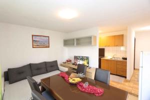 a living room with a couch and a table at Apartment in Silo/Insel Krk 13555 in Šilo