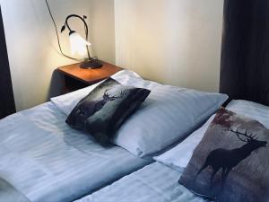 Postel nebo postele na pokoji v ubytování Willa Pod Górami