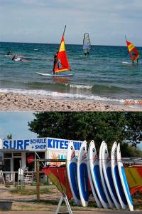 a group of sail boats on the beach with surfboards at Am Strand 2, PP innen in Zingst