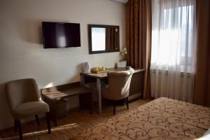 TV a/nebo společenská místnost v ubytování Hotel Divan