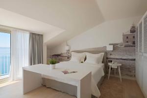 Postel nebo postele na pokoji v ubytování Hotel Osejava