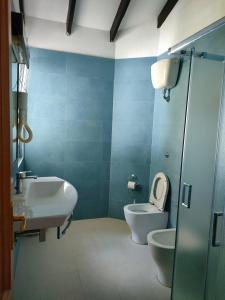 a bathroom with a toilet and a bidet and a sink at Villa Luana Yuna in Au Cap +79 photos
