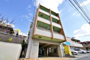 a building on the side of a street at Hana house - Vacation STAY 92529v in Ginowan