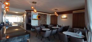 A seating area at THEMIS BEACH