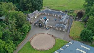 an aerial view of a house with a large driveway at The Towerview Coach Houses in Perth