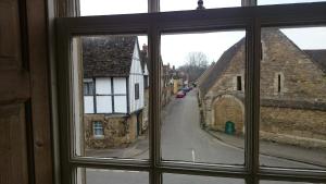 a view of a street from a window at The Red Lion in Lacock