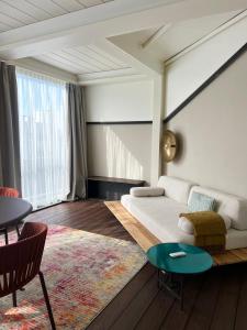 a living room with a couch and a table at Boutique Hotel Martini 17 in Milan