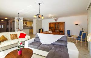 a living room with a couch and a table at Beautiful Home In Flachres With Kitchen in Flachères