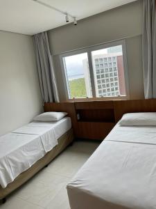 Katil atau katil-katil dalam bilik di Salinas Exclusive Resort Salinópolis