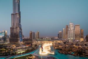 a view of a city with a fountain and buildings at Elite Royal Apartment - Full Burj Khalifa & Fountain View - Sapphire in Dubai